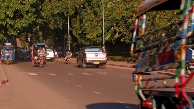 Street Scene in Vientiane — Typical street traffic in the capital city of VientianeKeywords: Laos, Vientiane, streets, traffic