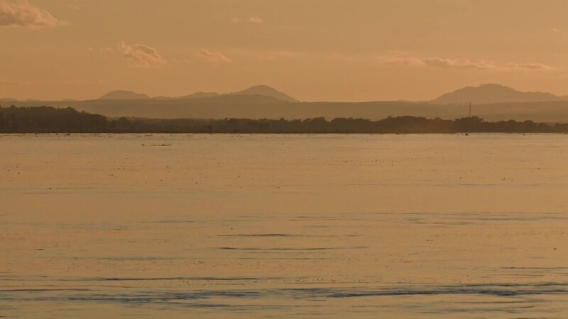 Sunset on the Mekong — The Mekong river flows through Laos, providing life and transportation — Laos, Mekong River, Sunset, Scenic