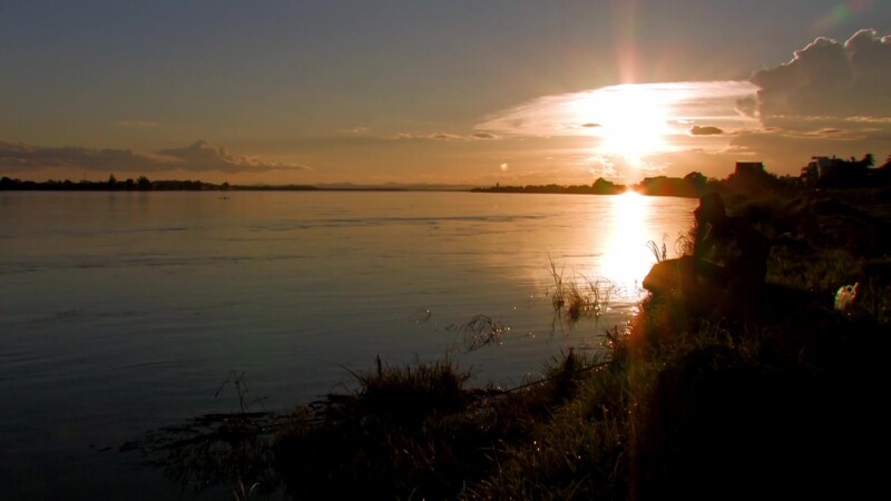 Sunset on the Mekong — The Mekong river flows through Laos, providing life and transportation — Laos, Mekong River, Sunset, Scenic