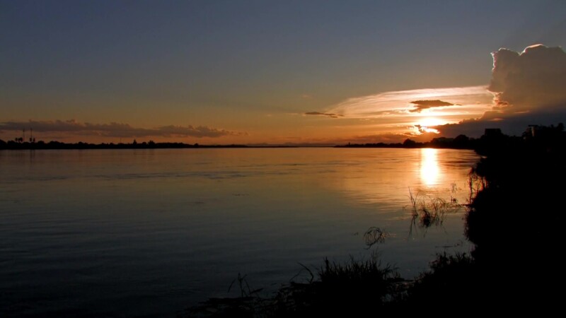 Sunset on the Mekong — The Mekong river flows through Laos, providing life and transportation — Laos, Mekong River, Sunset, Scenic