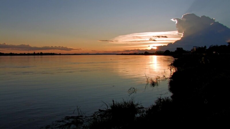 Sunset on the Mekong — The Mekong river flows through Laos, providing life and transportation — Laos, Mekong River, Sunset, Scenic