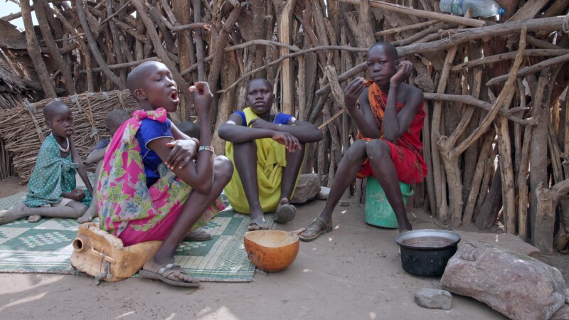 Children Eat — Children in South Sudan, Africa eat a simple meal of sorghum. — Africa, South Sudan, Rural, Remote, Pastoralists