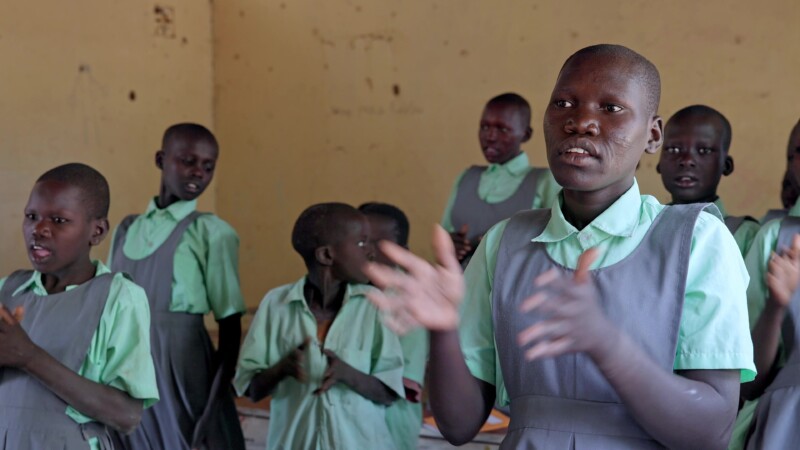Singing In School in Africa — Students in South Sudan sig about how happy they are to attend school and learn. — Africa, South Sudan, Rural, Remote, Pastoral...