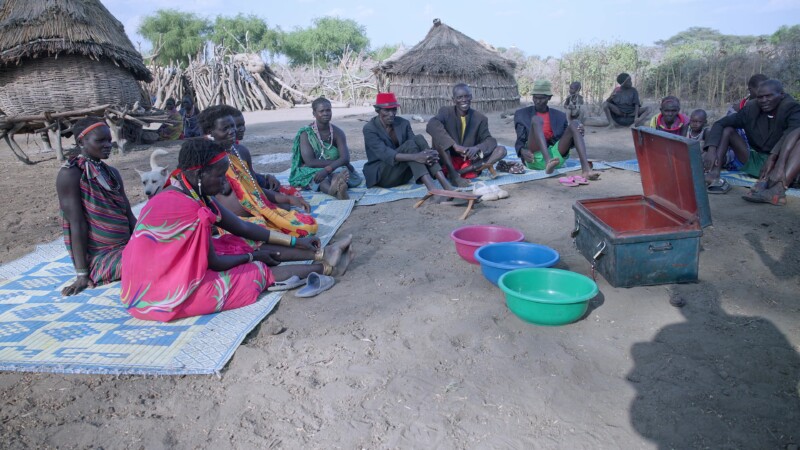 Savings and Loans Group — Villagers in South Sudan attend their weekly meeting to learn about finance and participate in a village Savings and loans program,...