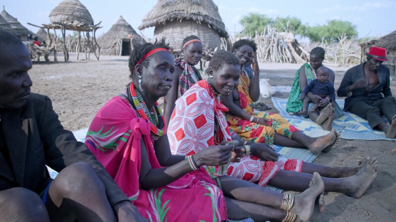 Savings and Loans Group — Villagers in South Sudan attend their weekly meeting to learn about finance and participate in a village Savings and loans program,...