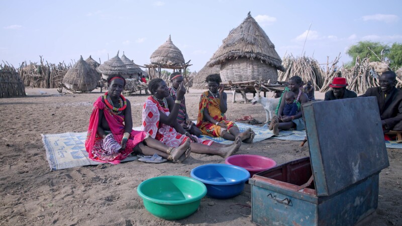 Savings and Loans Group — Villagers in South Sudan attend their weekly meeting to learn about finance and participate in a village Savings and loans program,...