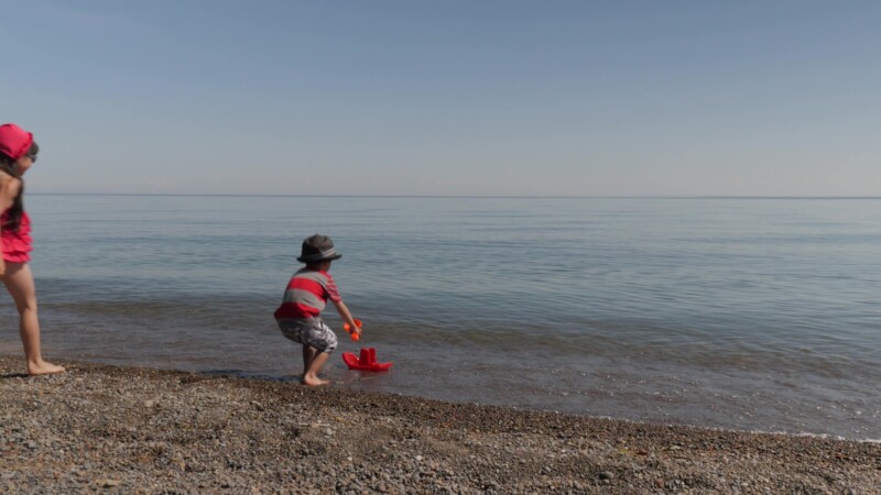 Kids at the Beach — Children play at the Beach at Lake Ontario in CanadaKeywords: Canada, Scenic, Ontario