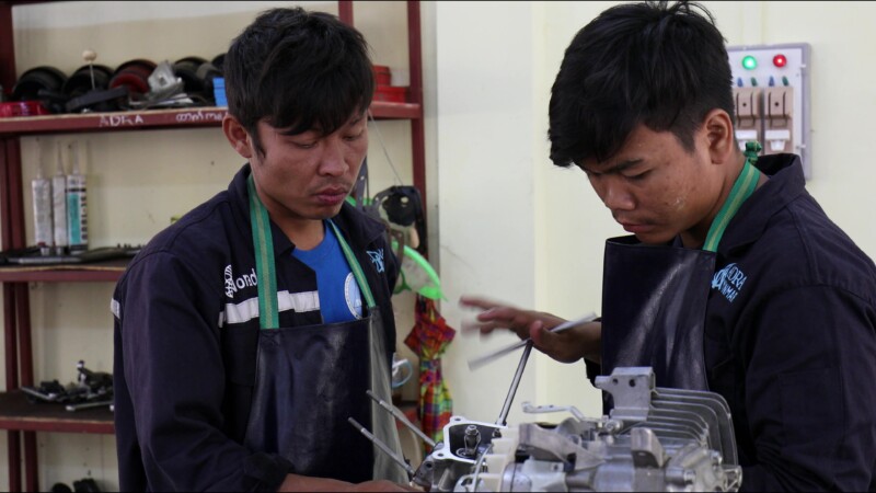 Small Engine Repair — Young men in Myanmar learn how to repair the small engines that farmers use to plow their fieldsKeywords: Myanmar, Burma, Burmese, Kare...