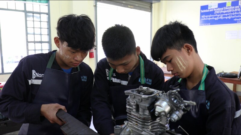 Small Engine Repair — Young men in Myanmar learn how to repair the small engines that farmers use to plow their fieldsKeywords: Myanmar, Burma, Burmese, Kare...