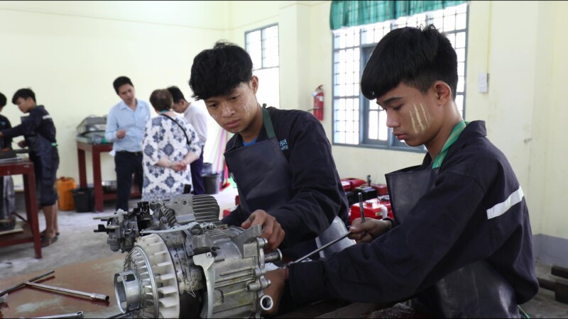 Small Engine Repair — Young men in Myanmar learn how to repair the small engines that farmers use to plow their fieldsKeywords: Myanmar, Burma, Burmese, Kare...