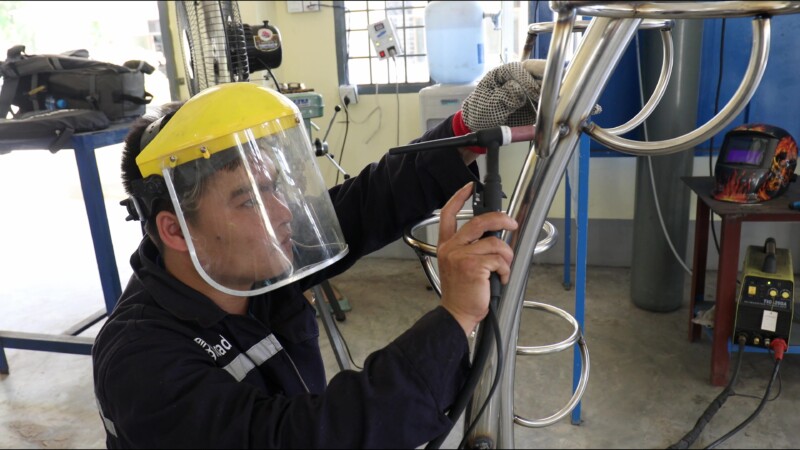 Learning How to Weld — At a trade school in Myanmar, students learn the skill of welding to prepare them with an livelihood skill. — Myanmar, Burma, Burmese,...