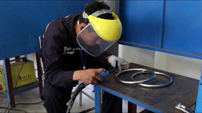 Learning How to Weld — At a trade school in Myanmar, students learn the skill of welding to prepare them with an livelihood skill. — Myanmar, Burma, Burmese,...