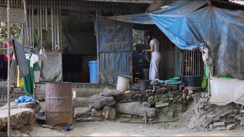 Cooking Food — A young girl in Myanmar cooks dinner for her family in an open kitchen outside her home. — Myanmar, Burma, Burmese, Karen, cooking