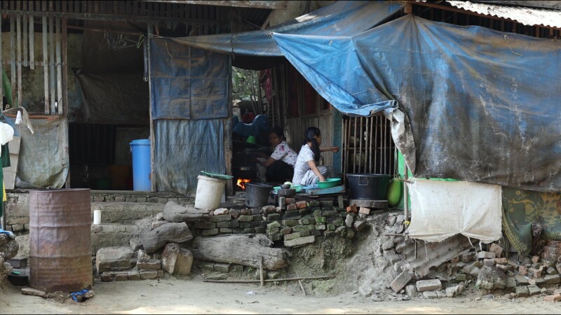 Cooking Food — A young girl in Myanmar cooks dinner for her family in an open kitchen outside her home. — Myanmar, Burma, Burmese, Karen, cooking