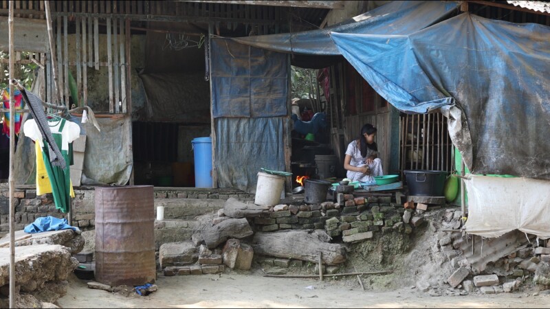 Cooking Food — A young girl in Myanmar cooks dinner for her family in an open kitchen outside her home. — Myanmar, Burma, Burmese, Karen, cooking
