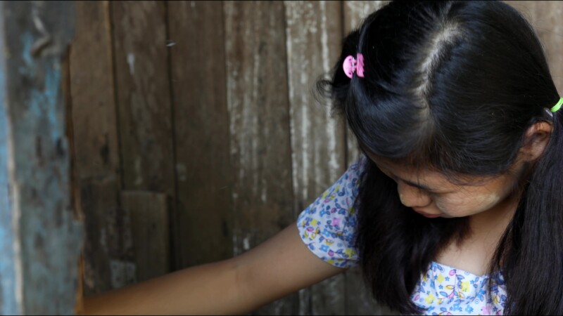 Cooking Food — A young girl in Myanmar cooks dinner for her family in an open kitchen outside her home. — Myanmar, Burma, Burmese, Karen, cooking