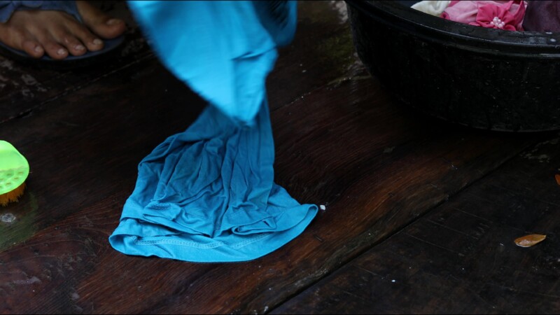 Washing Clothes — Young woman in Myanmar washes clothes for her family. — Myanmar, Burma, Burmese, Karen, washing clothes