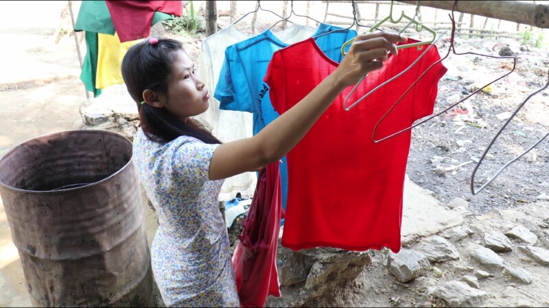 Washing Clothes — Young woman in Myanmar washes clothes for her family. — Myanmar, Burma, Burmese, Karen, washing clothes