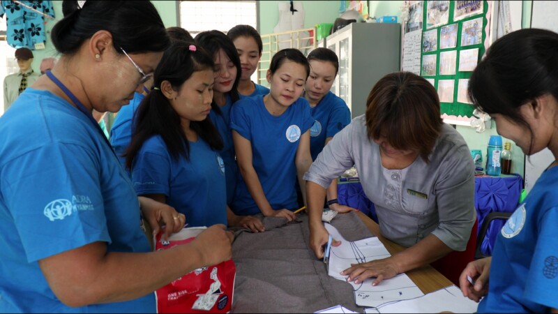 Attending a Trade school — Young hearing impaired girl goes to a trade school each day to learn how to make clothes so she can start her own income generatin...