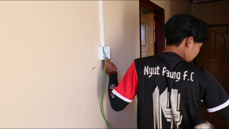 Wireing a House — After getting his certificate from a trade school in Myanmar, run by ADRA, a young many starts his own business wiring homes in his village...
