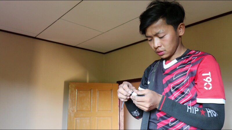 Wireing a House — After getting his certificate from a trade school in Myanmar, run by ADRA, a young many starts his own business wiring homes in his village...