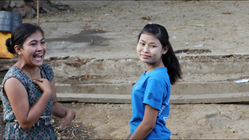 Hearing Impaired Woman Talks with her Hands — A young woman in Myanmar talks with her sister using sign language. — Myanmar, Burma, Burmese, Karen, sign lang...