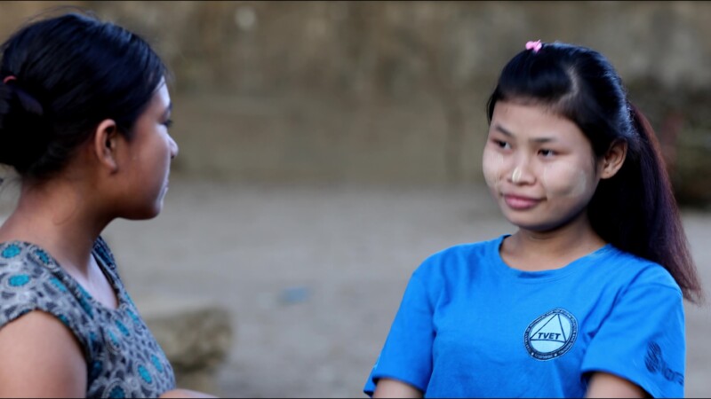 Hearing Impaired Woman Talks with her Hands — A young woman in Myanmar talks with her sister using sign language. — Myanmar, Burma, Burmese, Karen, sign lang...