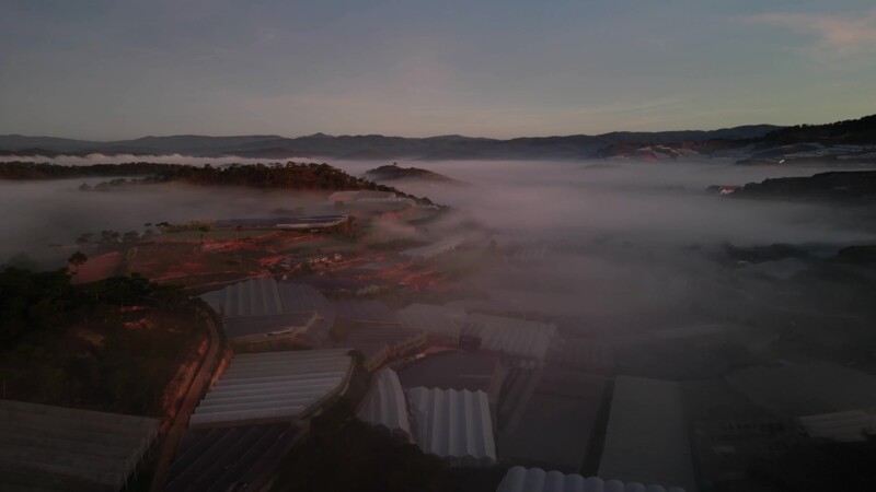 Early Morning Flight — Drone flys high above the greenhouses of Da Lat, Vietnam at sunrise. — Drone, Flyover, scenic, Vietnam, Da Lat
