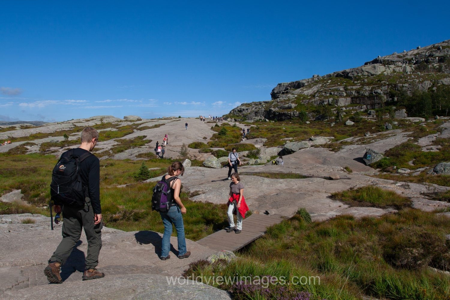 People hiking up to Pulpit Rock