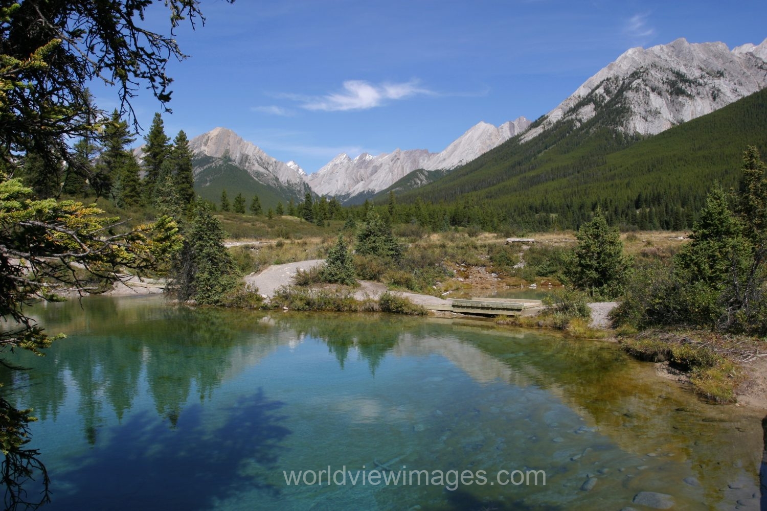 Stock Images of Lakes: Mountain Springs create colorful pond high up in the mountains in Banff National Park, in Alberta Canada