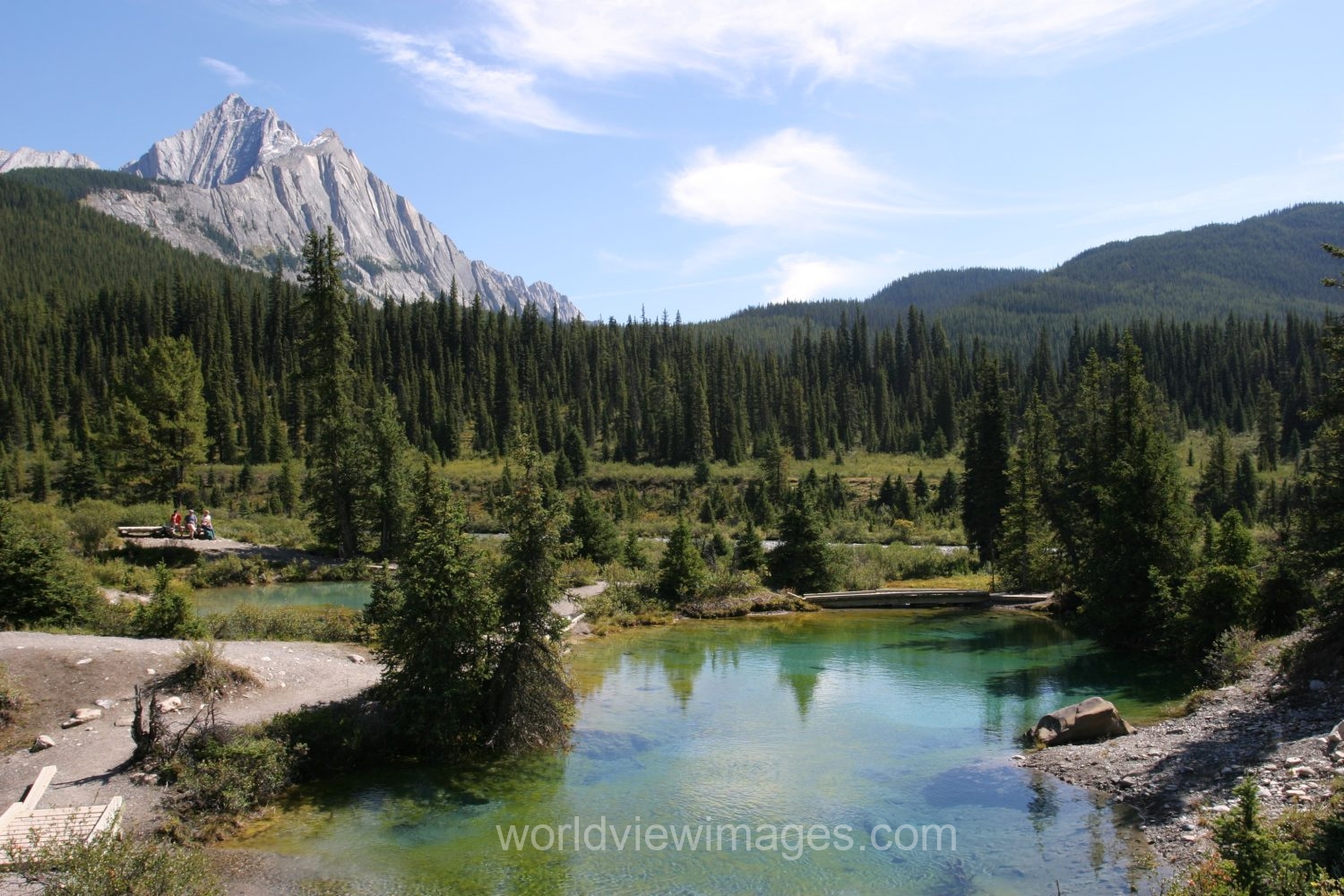 Stock Images of Lakes: Mountain Springs create colorful pond high up in the mountains in Banff National Park, in Alberta Canada