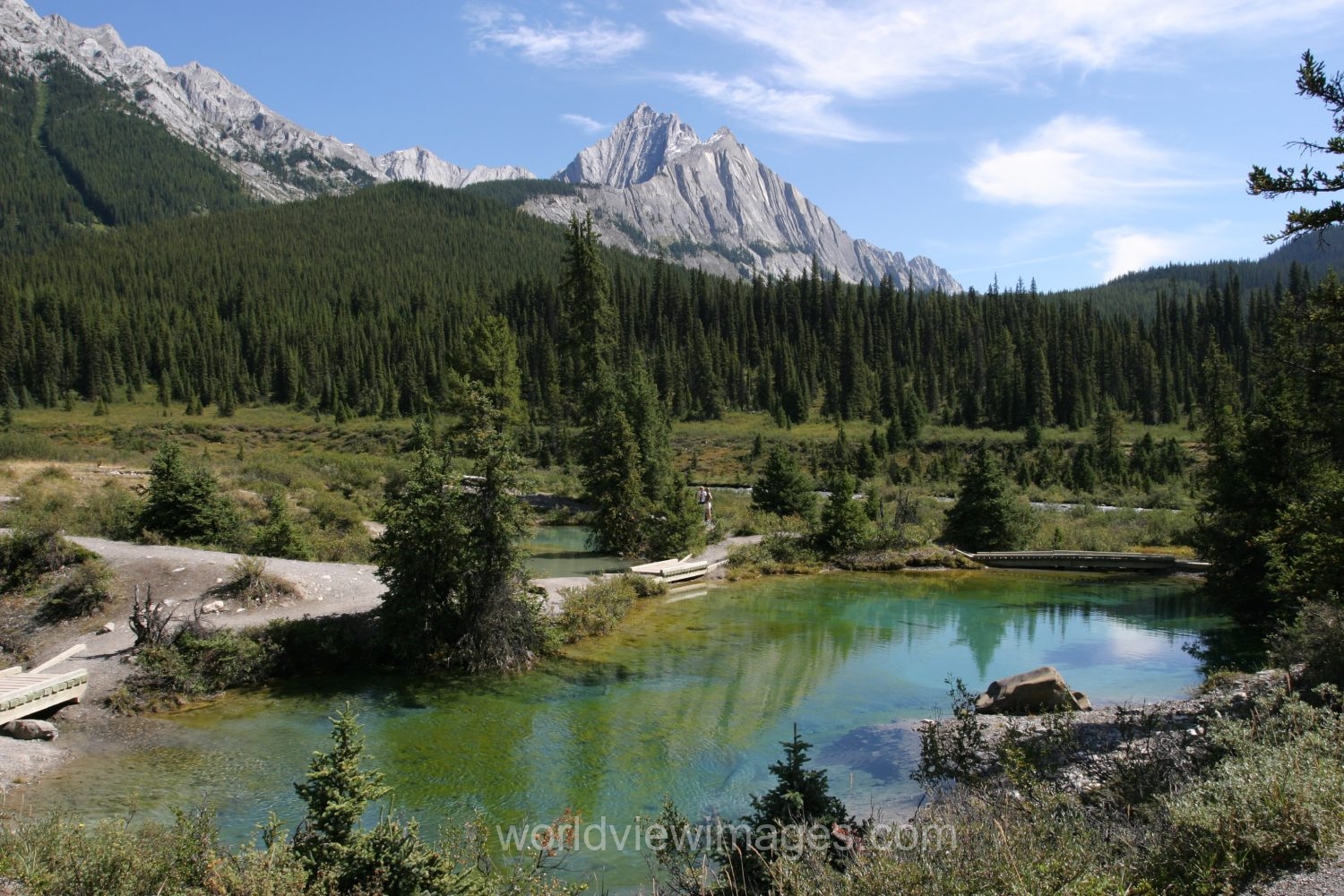 Stock Images of Lakes: Mountain Springs create colorful pond high up in the mountains in Banff National Park, in Alberta Canada